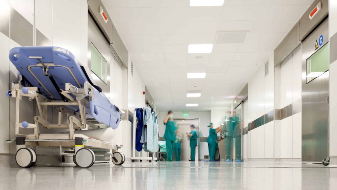 Hospital corridor with medical staff and climate-controlled HVAC